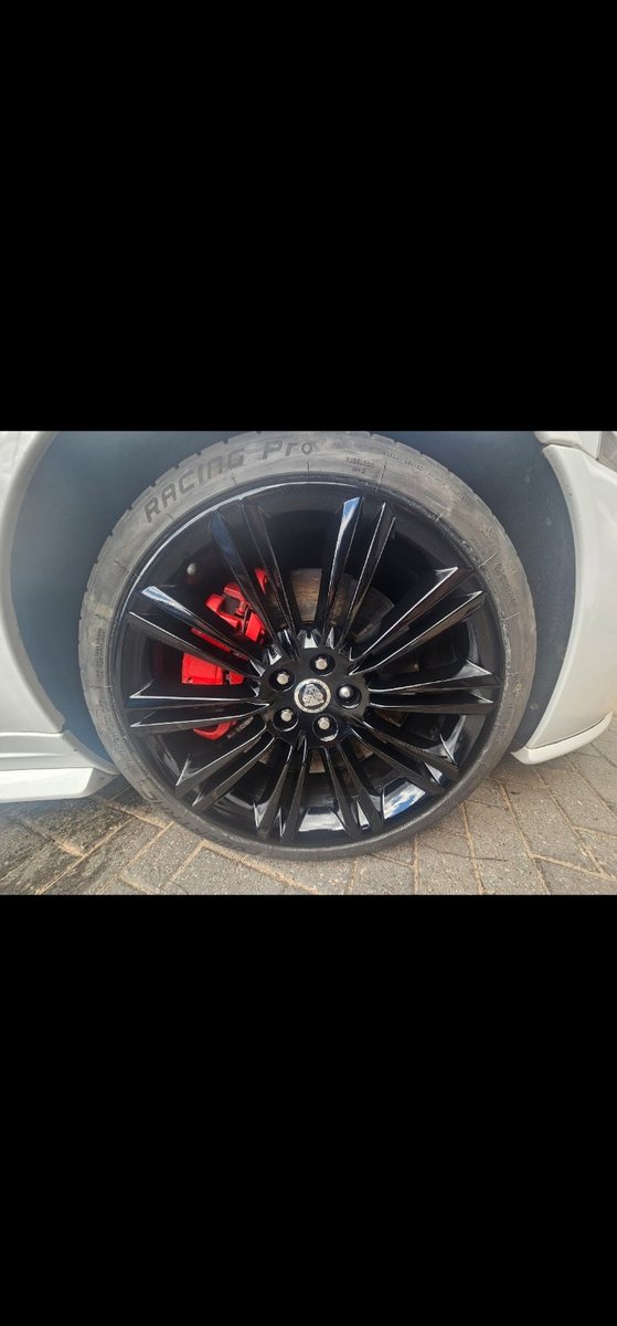 Gloss black repaired alloy wheel